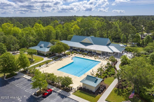 489 Broomsedge Ct SE, Bolivia, NC 28422 - drone / aerial view of a heavily wooded area and a pool