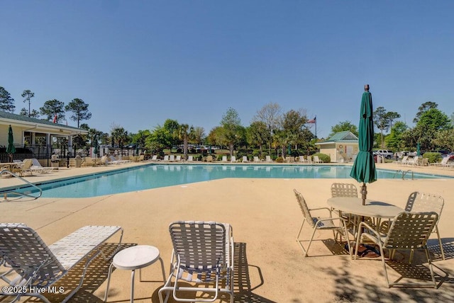 489 Broomsedge Ct SE, Bolivia, NC 28422 - community pool featuring a patio area