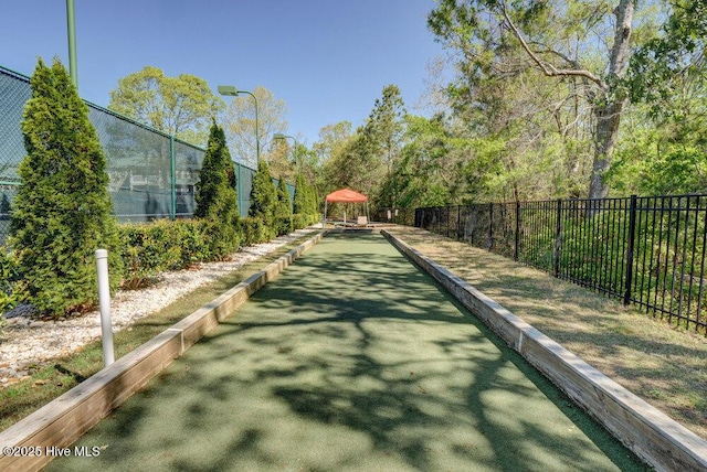 489 Broomsedge Ct SE, Bolivia, NC 28422 - view of tennis court with a bocce ball area