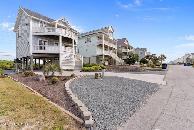126 S Permuda Wynd Dr, North Topsail Beach, NC 28460 - exterior space featuring stairs, a carport, and a residential view