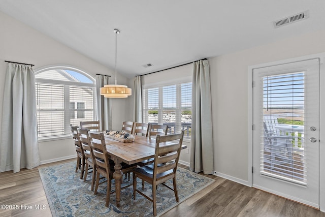 126 S Permuda Wynd Dr, North Topsail Beach, NC 28460 - dining space featuring healthy amount of natural light, wood finished floors, and vaulted ceiling