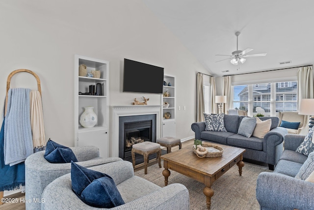 126 S Permuda Wynd Dr, North Topsail Beach, NC 28460 - living area featuring built in features, a ceiling fan, a fireplace, baseboards, and high vaulted ceiling