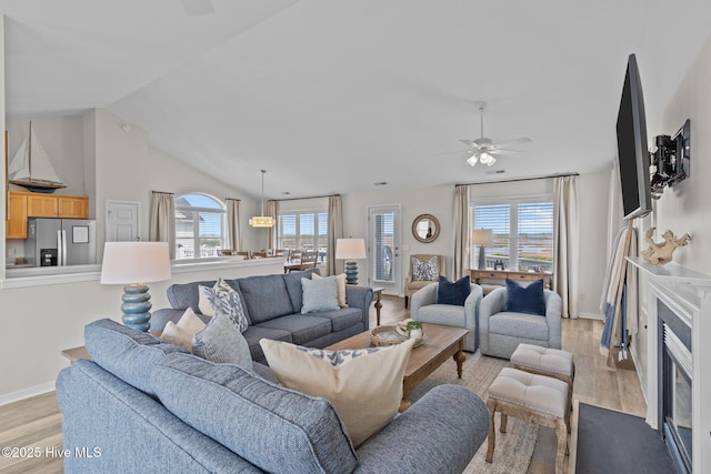 126 S Permuda Wynd Dr, North Topsail Beach, NC 28460 - living area with light wood-style floors, ceiling fan, lofted ceiling, and baseboards