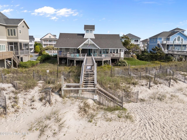 126 S Permuda Wynd Dr, North Topsail Beach, NC 28460 - rear view of property featuring a residential view, stairway, fence, and a deck