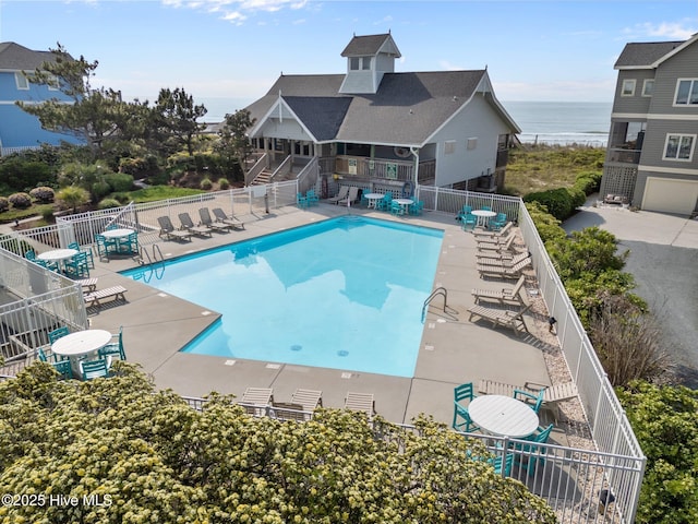 126 S Permuda Wynd Dr, North Topsail Beach, NC 28460 - community pool with a patio area, fence, a water view, and stairway