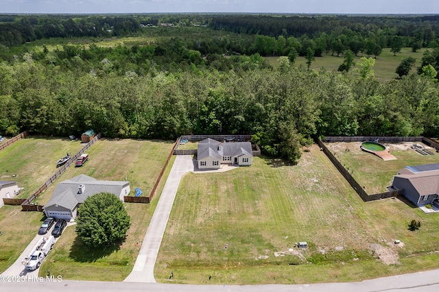 drone / aerial view featuring a view of trees