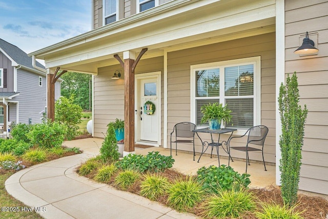view of exterior entry with covered porch