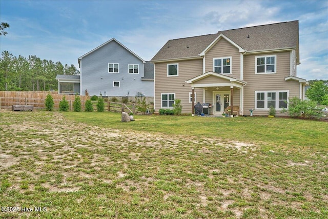 rear view of house featuring french doors
