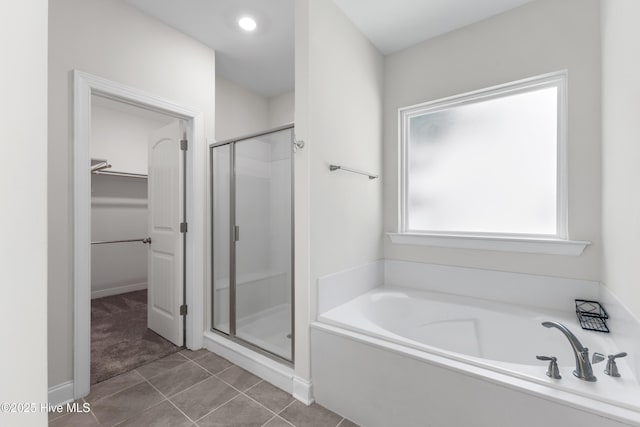 365 W Goldeneye Ln, Sneads Ferry, NC 28460 - bathroom with a shower stall, vanity, a walk in closet, a bath, and recessed lighting