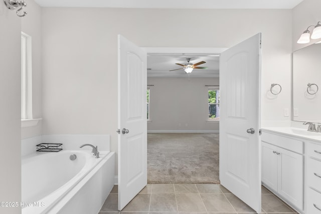 365 W Goldeneye Ln, Sneads Ferry, NC 28460 - full bathroom with ceiling fan, double vanity, tile patterned floors, and baseboards