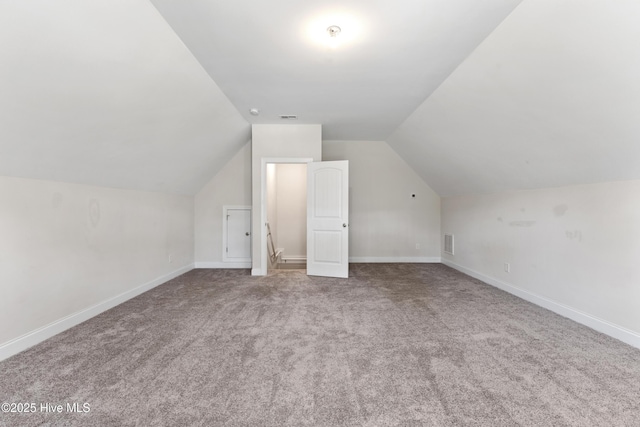 365 W Goldeneye Ln, Sneads Ferry, NC 28460 - bonus room with vaulted ceiling, carpet, and baseboards