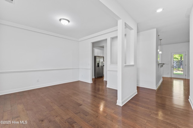 365 W Goldeneye Ln, Sneads Ferry, NC 28460 - empty room featuring baseboards, dark wood-type flooring, and ornamental molding