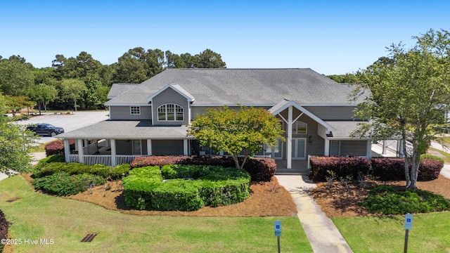 365 W Goldeneye Ln, Sneads Ferry, NC 28460 - view of front of home featuring a front lawn and a shingled roof