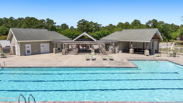 365 W Goldeneye Ln, Sneads Ferry, NC 28460 - community pool featuring a pergola, fence, a patio area, and view of scattered trees