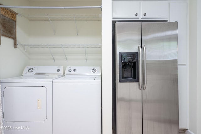 laundry room featuring washing machine and clothes dryer and laundry area