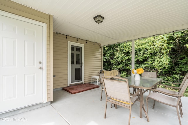 view of patio with outdoor dining area