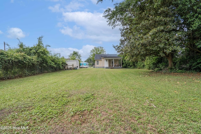 view of yard featuring a sunroom