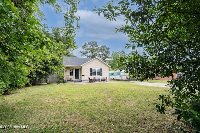 view of yard featuring fence and a patio area