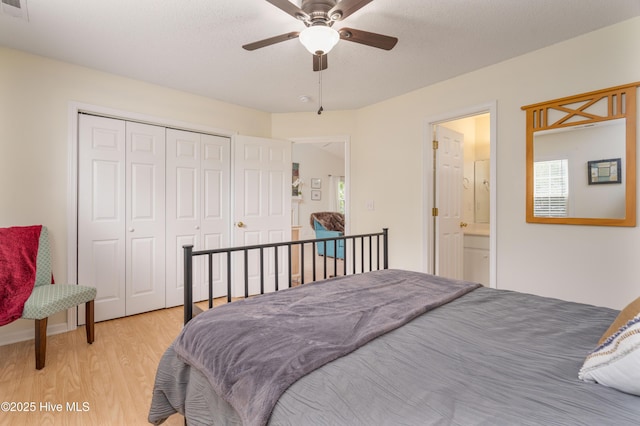 bedroom featuring light wood finished floors, a closet, and ceiling fan