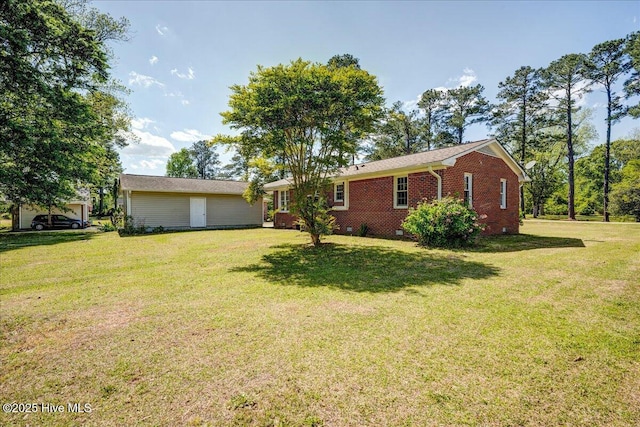 exterior space with a yard and brick siding