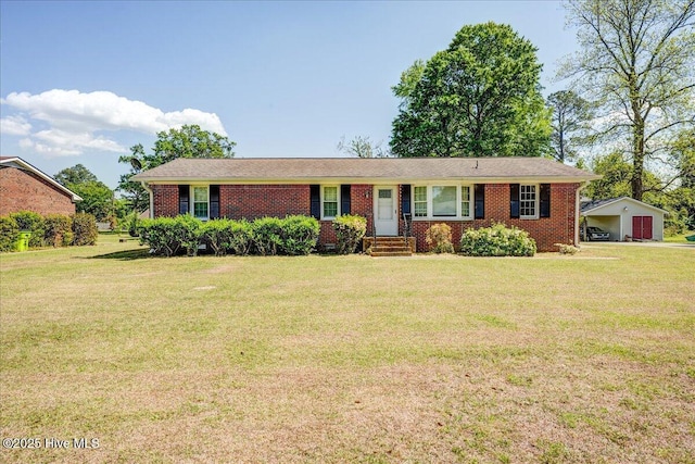 ranch-style house featuring a front yard and brick siding