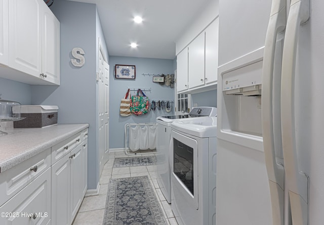 1 Collett Ln, Pinehurst, NC 28374 - laundry area with separate washer and dryer, cabinet space, light tile patterned floors, recessed lighting, and baseboards