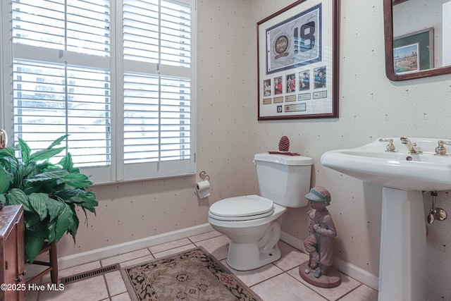 1 Collett Ln, Pinehurst, NC 28374 - half bath with tile patterned floors, plenty of natural light, and toilet
