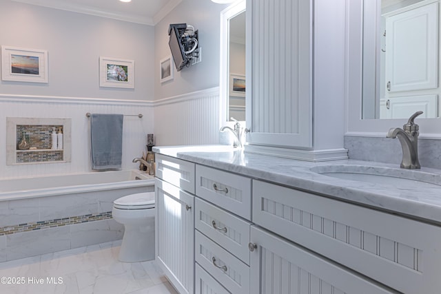 1 Collett Ln, Pinehurst, NC 28374 - bathroom featuring marble look tiles, a bathtub, toilet, double vanity, and a wainscoted wall