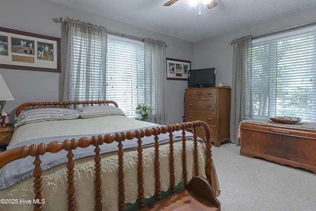 1 Collett Ln, Pinehurst, NC 28374 - carpeted bedroom with ceiling fan and a textured ceiling