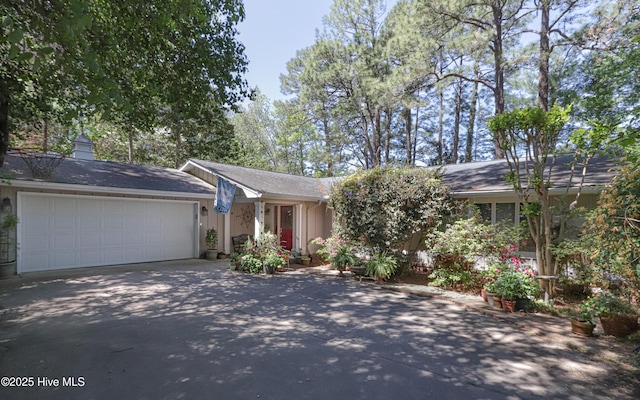 1 Collett Ln, Pinehurst, NC 28374 - view of front facade featuring driveway and a garage