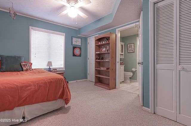 1 Collett Ln, Pinehurst, NC 28374 - bedroom featuring light colored carpet, baseboards, a textured ceiling, ensuite bathroom, and crown molding