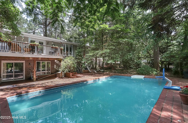 1 Collett Ln, Pinehurst, NC 28374 - swimming pool with stairs, a deck, and a patio area