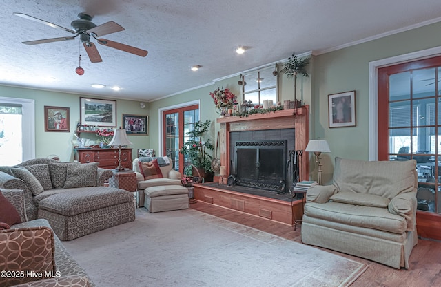 1 Collett Ln, Pinehurst, NC 28374 - living area featuring ceiling fan, crown molding, a fireplace, wood finished floors, and recessed lighting