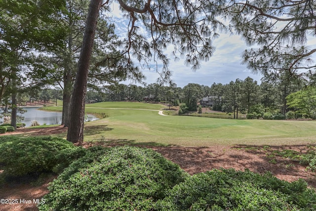12 Shenecossett Ln, Pinehurst, NC 28374 - view of home's community with a water view, golf course view, a yard, and view of wooded area