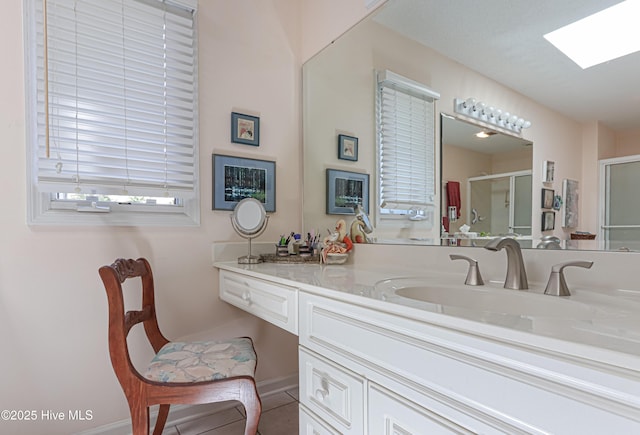 12 Shenecossett Ln, Pinehurst, NC 28374 - full bathroom with a stall shower, vanity, a skylight, and baseboards