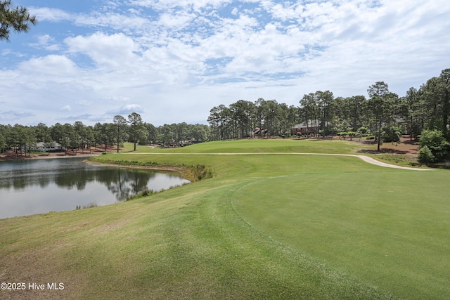12 Shenecossett Ln, Pinehurst, NC 28374 - view of property's community featuring a water view, golf course view, view of scattered trees, and a yard
