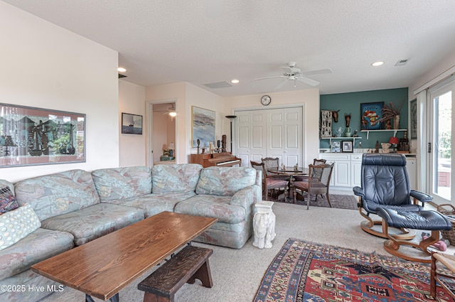 12 Shenecossett Ln, Pinehurst, NC 28374 - carpeted living room with ceiling fan, recessed lighting, and a textured ceiling