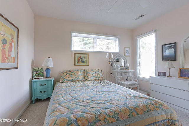 12 Shenecossett Ln, Pinehurst, NC 28374 - carpeted bedroom with baseboards and a textured ceiling