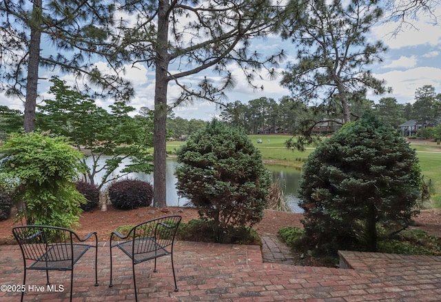 12 Shenecossett Ln, Pinehurst, NC 28374 - view of patio / terrace featuring a water view