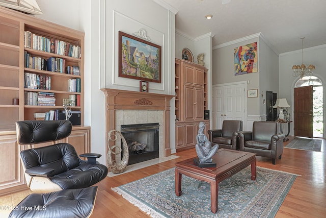 127 Sakonnet Trl, Pinehurst, NC 28374 - living area with crown molding, wood finished floors, and a tiled fireplace