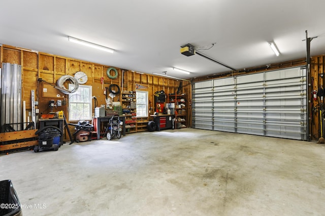 3243 Marsh View Dr SW, Supply, NC 28462 - garage featuring a workshop area and a garage door opener