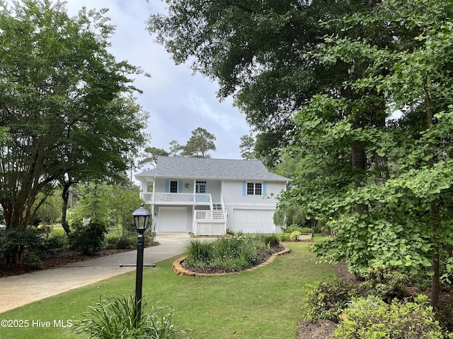3243 Marsh View Dr SW, Supply, NC 28462 - view of front facade with an attached garage, a front lawn, stairs, and driveway