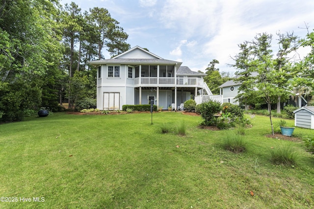 3243 Marsh View Dr SW, Supply, NC 28462 - view of front of house with a sunroom, stairs, and a front yard