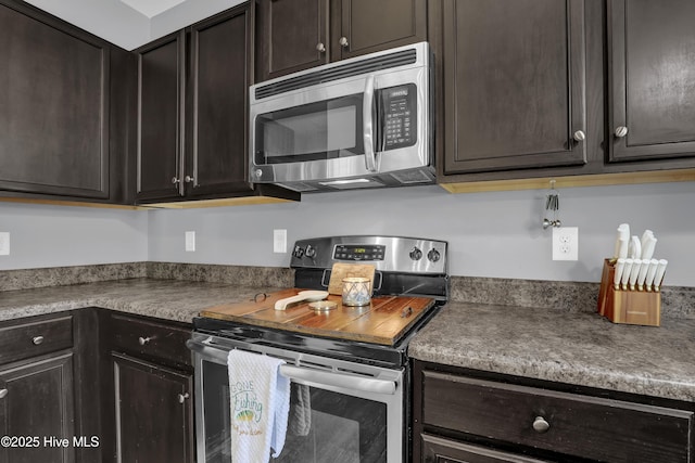 133 Fallbrook Ln, Rocky Point, NC 28457 - kitchen featuring appliances with stainless steel finishes and dark brown cabinets