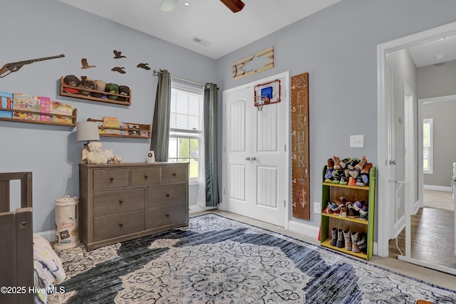 133 Fallbrook Ln, Rocky Point, NC 28457 - bedroom with multiple windows, a closet, ceiling fan, and baseboards