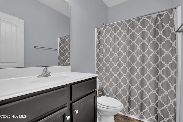 133 Fallbrook Ln, Rocky Point, NC 28457 - full bath with toilet, vanity, wood finished floors, and curtained shower