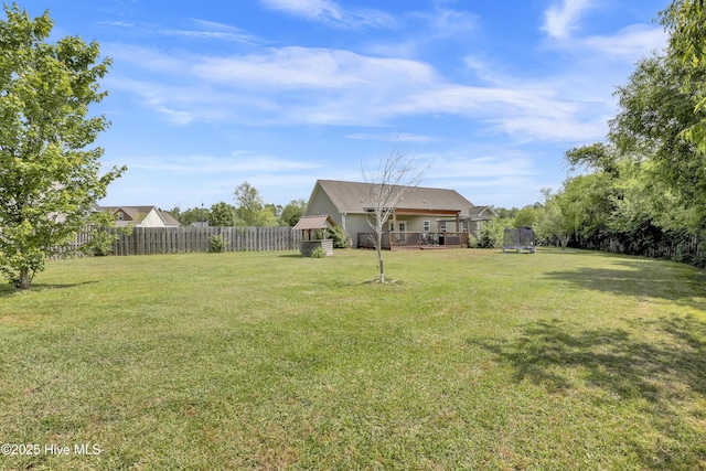 133 Fallbrook Ln, Rocky Point, NC 28457 - view of yard with a deck and a trampoline