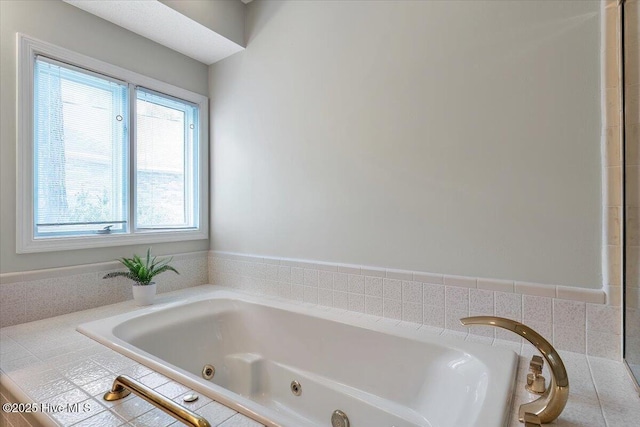 full bathroom with a tub with jets