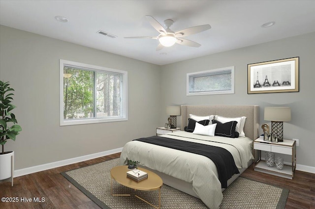 bedroom with baseboards, wood finished floors, and a ceiling fan