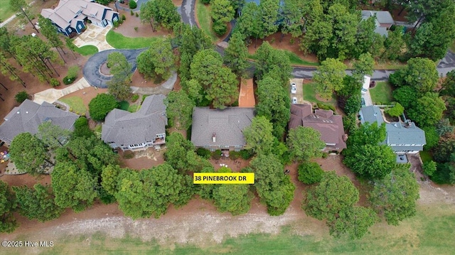 aerial overview of property's location with nearby suburban area